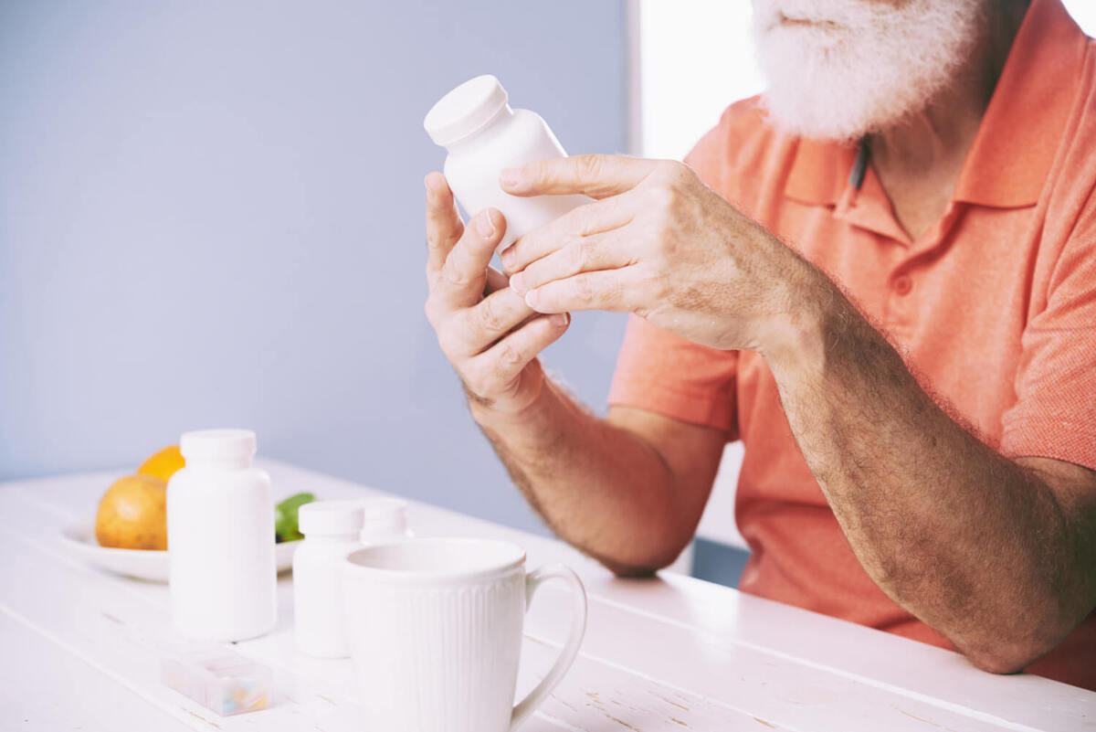 Examining pill bottle 