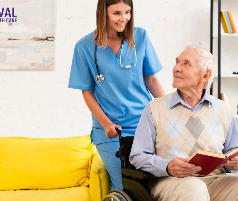 Old man sitting on wheelchair while talking to nurse