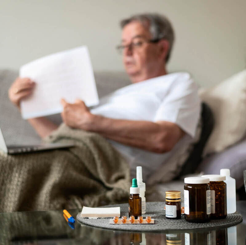 Medium shot blurry ill man on couch