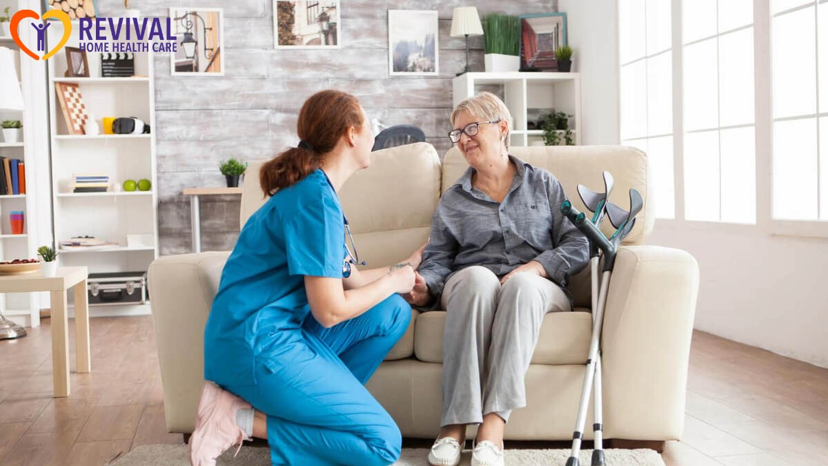 Happy old woman in a nursing home sitting on couch talking with her caretaker. retired woman with crutches.